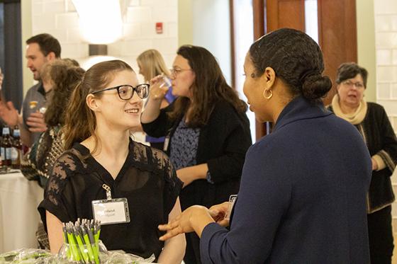 Photo of an employer and student speaking at a Career Development fair